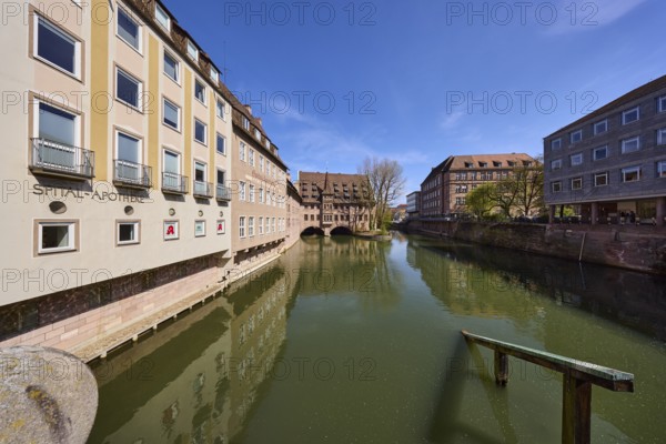 Heilig-Geist-Spital, Spital-Apotheke, historical buildings, river Pegnitz, facade, windows, trees, symmetrical reflections, water surface, blue sky, cirrostratus clouds, Pfarrgasse, Nuremberg, Middle Franconia, independent city, Bavaria, Germany