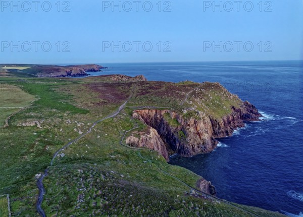 Land's End, coast and landscape on the Atlantic, at dusk. Land's End, the tip of the headland in the west of Cornwall, is the most westerly point in England. Land's End, Sennen, Penzance, Cornwall, South West England, Great Britain