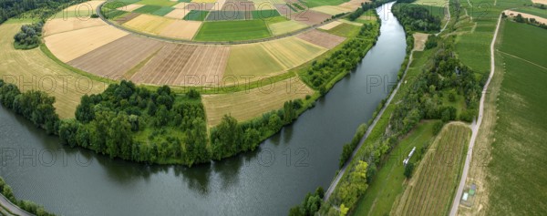 Agricultural area in the Neckarbogen near Lauffen am Neckar. Cereal fields in different shades of green. Neckar bend near Lauffen am Neckar, Baden-Württemberg, Germany