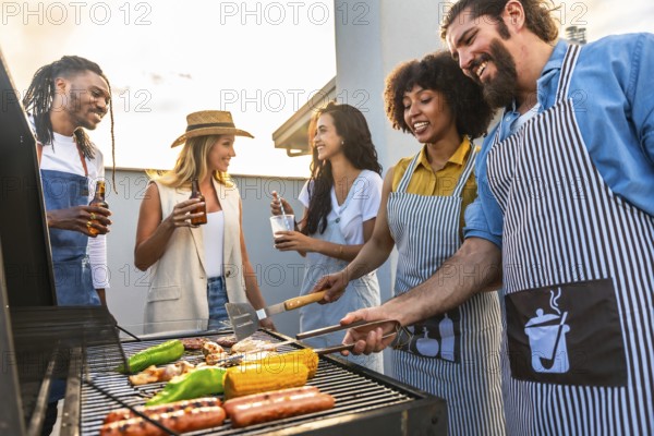Chefs grilling delicious meat and vibrant vegetables while enjoying cold beer on a rooftop during a stunning sunset with friends
