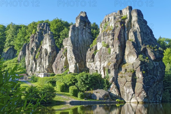 The Externsteine, a sandstone rock formation around 40 metres high in the Teutoburg Forest, are a natural landmark and a protected natural and cultural monument. They are regarded as a place of power and are said to have special cultural and historical significance. The rocks are located by the Wiembecketeich pond. Horn-Meinberg, North Rhine-Westphalia, Germany
