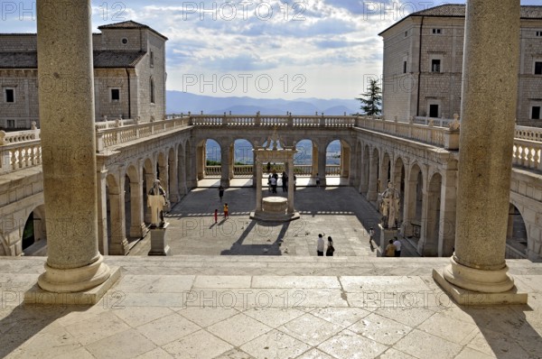 Bramante cloister with cistern and statues of St Benedict and St Scholastica of Nursia, Benedictine Abbey of Montecassino, Monte Cassino, Cassino, Frosinone, Lazio, Italy