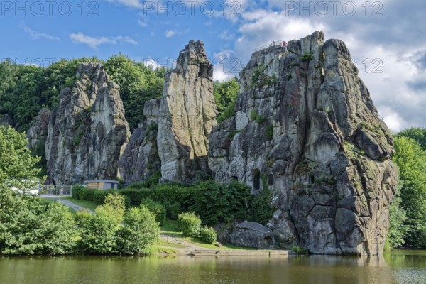 The Externsteine, a sandstone rock formation around 40 metres high in the Teutoburg Forest, are a natural landmark and a protected natural and cultural monument. They are regarded as a place of power and are said to have special cultural and historical significance. The rocks are located by the Wiembecketeich pond. Horn-Meinberg, North Rhine-Westphalia, Germany