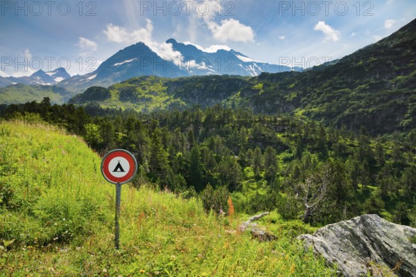 Prohibition sign Camping Verboten im Alpenraum on the Susten Pass with Chli Sustenhorn and Sustenhorn in the background, Switzerland