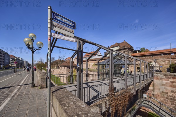 Old town, pedestrian bridge, city fortification, city wall, city gate, street sign, signpost, lantern, footpath and cycle path, general architecture, blue sky, cirrostratus clouds, Frauentor moat, Frauentor wall, Carthusian gate, Nuremberg, Middle Franconia, independent city, Bavaria, Germany