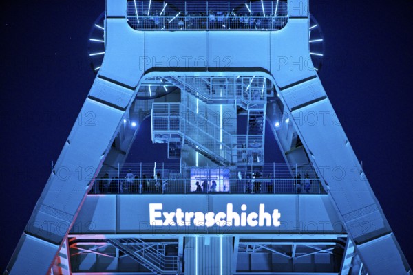 Illuminated headframe of the German Mining Museum with people, Extraschicht, Bochum, Ruhr area, North Rhine-Westphalia, Germany