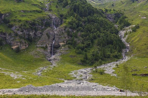 Waterfalls and green slopes in a rock face, Zinal valley, Val d'Anniviers, Valais Alps, Canton Valais, Switzerland