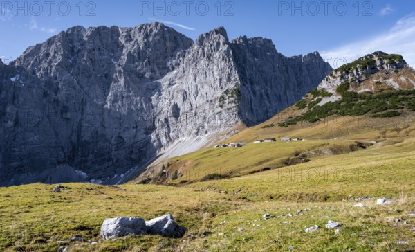 Rocky mountain ridge with summit Grubenkarspitze and Dreizinkenspitze, in front of it alpine huts of the Lalidersalm Hochleger, mountain landscape, Rißtal in the Eng, Karwendel, Tyrol, Austria