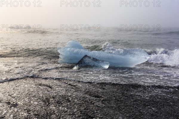 Melted iceberg, ice crystal on the beach, Diamond Beach in summer, haze, Jökulsárlón, Jökulsarlon, Vatnajökull National Park, Iceland