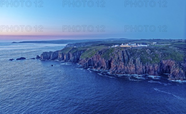 Land's End, landscape and hotel on the Atlantic, at dusk. Land's End, the tip of the headland in the west of Cornwall, is the most westerly point in England. Land's End, Sennen, Penzance, Cornwall, South West England, Great Britain