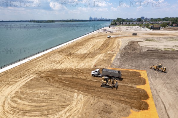 Detroit, Michigan - Workers spread clean dirt after old industrial contamination of cadmium, arsenic, lead, and other metals was removed from A.B. Ford Park on the Detroit River