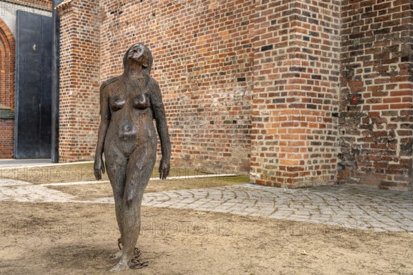 Sculpture of Mary Magdalene in the prison courtyard of the castle monastery, Hanseatic city of Lübeck, Schleswig-Holstein, Germany