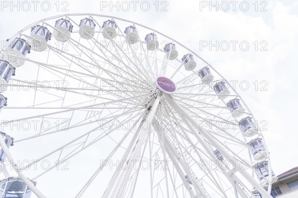 Stylish Ferris wheel with even structure in front of a blue sky, Ferris wheel construction, Calw, Germany