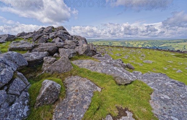 Stones and landscape at the top Tor tor rock hill in Dartmoor National Park. Widecombe-in-the-Moor, Bovey Tracey, Devon, South England, Great Britain