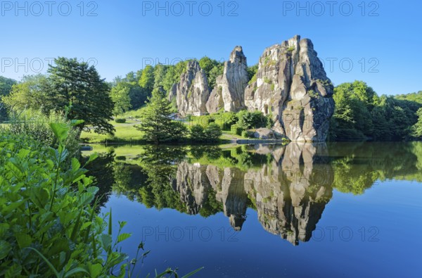 The Externsteine, a sandstone rock formation around 40 metres high in the Teutoburg Forest, are a natural landmark and a protected natural and cultural monument. They are regarded as a place of power and are said to have special cultural and historical significance. The rocks are located by the Wiembecketeich pond. Horn-Meinberg, North Rhine-Westphalia, Germany