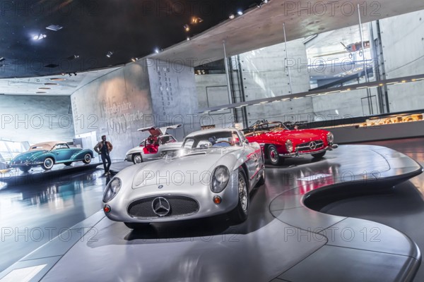 Mercedes-Benz 300 SLR Uhlenhaut Coupé from 1955. Two examples were built, one was auctioned. With proceeds of 135 million euros, it is the most valuable car in the world. The Mercedes-Benz Museum in Stuttgart presents a journey through the automotive history of the global corporation. The history of the Mercedes star begins with the first automobile in 1886. 160 vehicles are on display. Stuttgart, Baden-Württemberg, Germany