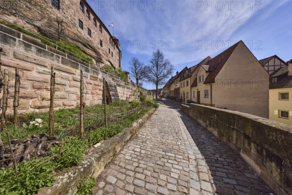 Old town, historic buildings, castle wall, sandstone wall, footpath, cobblestones, trees, garden, blue sky, cirrostratus clouds, Am Ölberg, Nuremberg, Middle Franconia, independent city, Bavaria, Germany