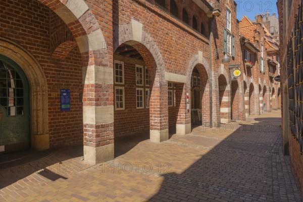 Archway at St Peter's House, Böttcherstrasse, cultural monument in the old town, numerous sights, red brick buildings, tourist attraction, pedestrian zone, Hanseatic city of Bremen, Germany