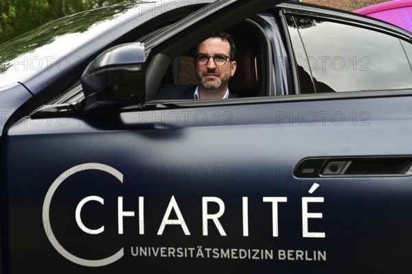 Charite and BMW launch study and test in-car sensors that measure and monitor health and vital signs. The picture shows Professor Alexander Meyer (Charite) in the driver's seat