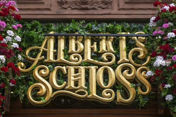 Sign for Albert's Schloss, bar beer hall restaurant, Shaftesbury Avenue, central London, England, UK