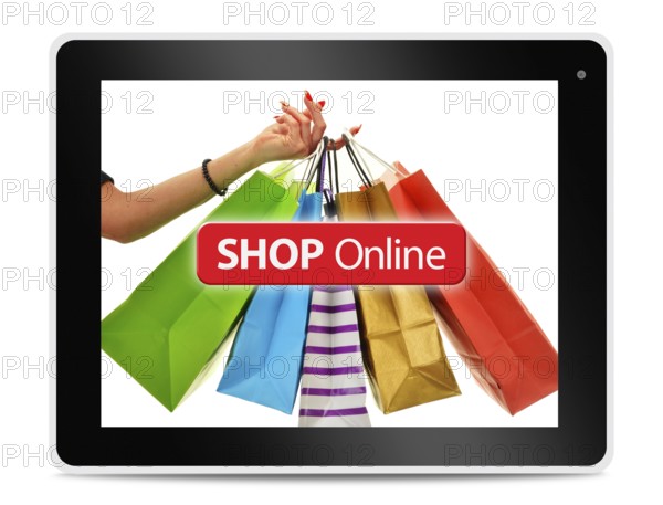 Paper shopping bags on computer tablet screen. Shopping online. E-commerce
