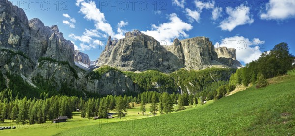 Mountains and pastures of the Sella plateau near Colfosco, 1, 645 m (5) (396 ft), at the foot of the Sella group (Grup dl Sela) and Mount Sassongher, the Dolomite mountains, Alta Badia, Italy