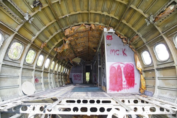 The interior of a derelict, vandalised aircraft in Bangkok, Thailand