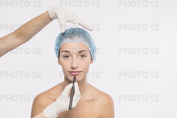 Pretty woman preparing injection by doctor