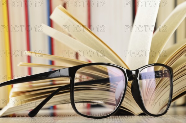 Composition with glasses and books on the table