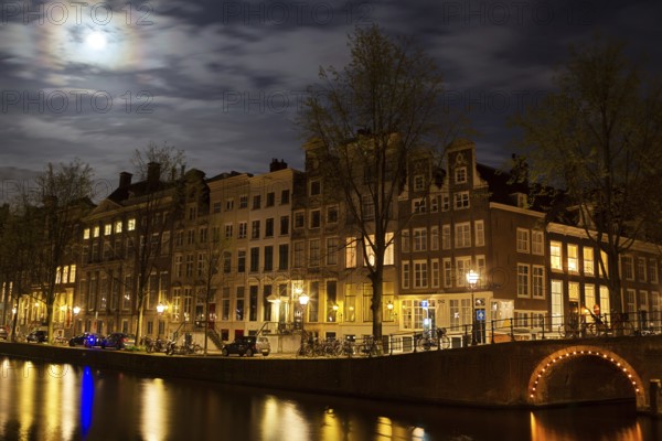 Full moon over the Herengracht in Amsterdam, Netherlands in springtime