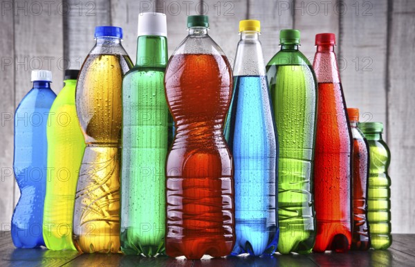 Plastic bottles of assorted carbonated soft drinks in variety of colors