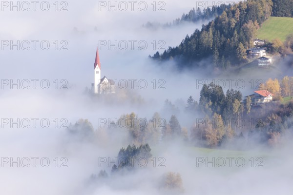 The Church of St. Peter in the fog, Weerberg, Tyrol, Austria