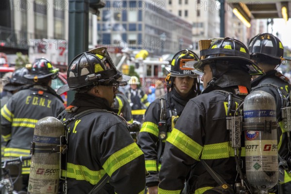 New York, United States of America, November 20, 2016: Group of firemen waiting in front of the Grand Central Market in Manhattan