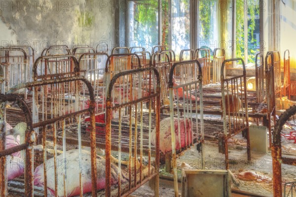 Beds in dormitory, Golden Key Kindergarten, Lost Place, Prypyat, Chernobyl exclusion zone, Ukraine, Eastern Europe