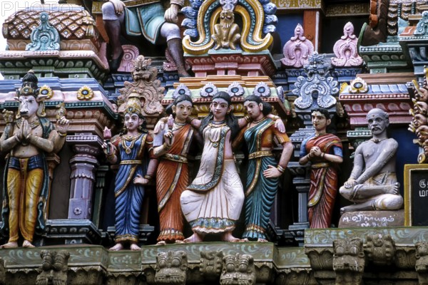 Stucco work portraying a woman about to deliver a baby in standing posture, Mallikeswarar temple in Chennai, Tamil Nadu, India, Asia