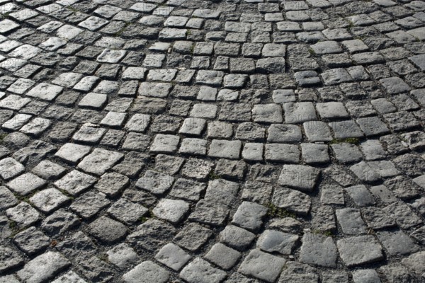 Cobblestone stone pavement background texture on the street