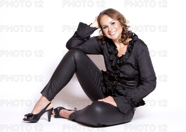 Beautiful woman wearing black upscale outfit on white background, Toronto, Canada