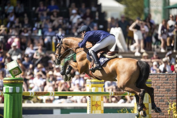 Daniel Deusser of Germany and riding Killer Queen VDM compete in the first round of the 1.60m CPKC International during the Spruce Meadows Masters, presented by Rolex, in Calgary, Alberta, Canada, North America