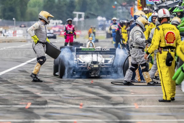 INDYCAR Series driver, RINUS VEEKAY (21) of Hoofddorp, Netherlands, brings his car in for service during the Bitnile.com Grand Prix of Portland at Portland International Raceway in Portland OR