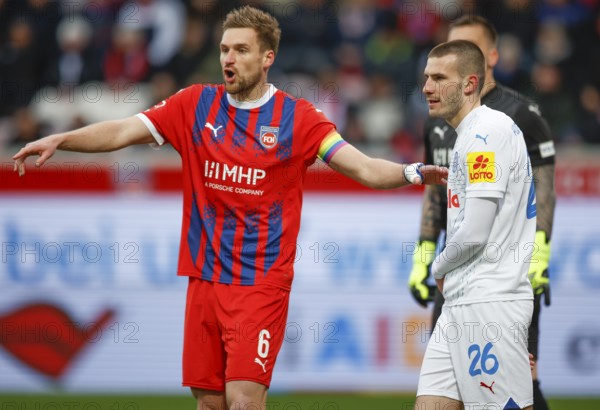 Football, Bundesliga 1, Matchday 26, 2024/2025, 1. FC Heidenheim vs. Holstein Kiel, 16.03.2025, Voith-Arena, Heidenheim, Germany, David ZEC (Holstein Kiel, 26) in a two-legged duel with Patrick MAINKA (1. FC Heidenheim, 06)