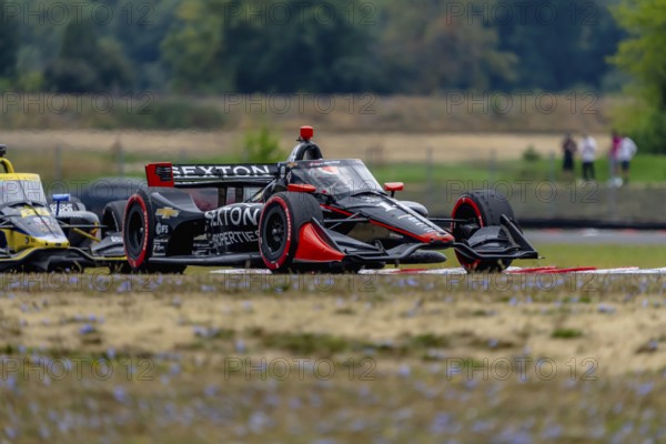 INDYCAR Series driver, SANTINO FERRUCCI (14) of Woodbury, Connecticut, races through the turns during the Bitnile.com Grand Prix of Portland at Portland International Raceway in Portland OR