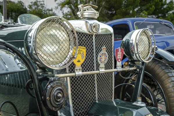 Lisbon, Portugal - Oct 15, 2023: Close-up of front side of MG K-Type Magnette, K3 version, by MG car company Ltd, UK during annual Classic Car Owners meeting. Big headlights, radiator grille, open tourer class of sports car of 1930s, selective focus