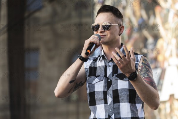 WROCLAW, POLAND - MAY 1, 2025: World Guitar Record concert, 8122 participants played Jimi Hendrix's song Hey Joe on guitars in the Wroclaw market square. Singer Krzysztof Sokolowski from band Nocny Kochanek