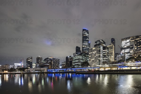 MELBOURNE, AUSTRALIA - JULY 5, 2024: Melbourne skyline as seen at dusk from Queens Bridge near Southbank in Melbourne, Victoria, Australia