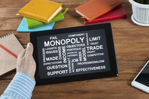 Close-up, male hands with tablet. Businessman working at the table in office