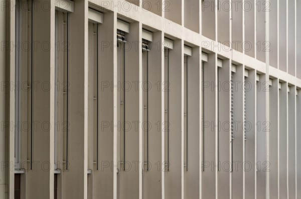 Long rows of windows of an office building from the 1960s