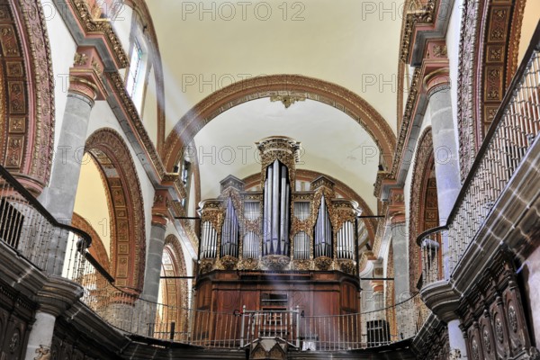Oaxaca, Mexico, Central America, Baroque organ in a church with richly decorated pipes and wooden case
