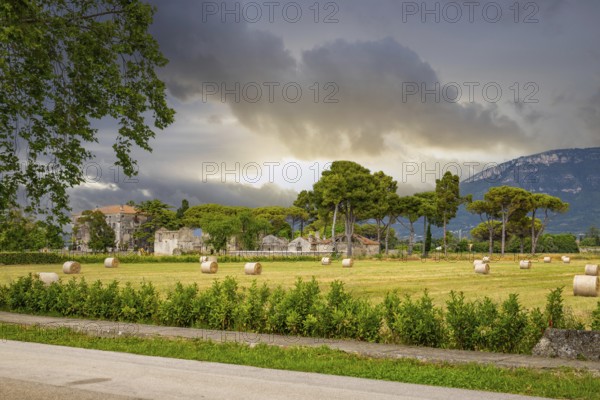 Beautiful old historical centre with ruins. Evening sunshine and the Temple of Athena in Paestum, Salerno, Italy