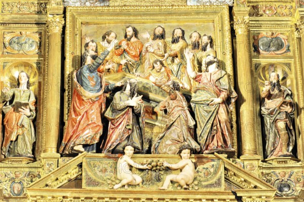 Detail of a baroque relief with religious figures and golden decorations, Iglesia de Santa Maria de la Asuncion, Arcos de la Frontera, Province of Cadiz, Andalusia, Spain