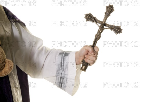 A Catholic priest with a cross during a church service Austria